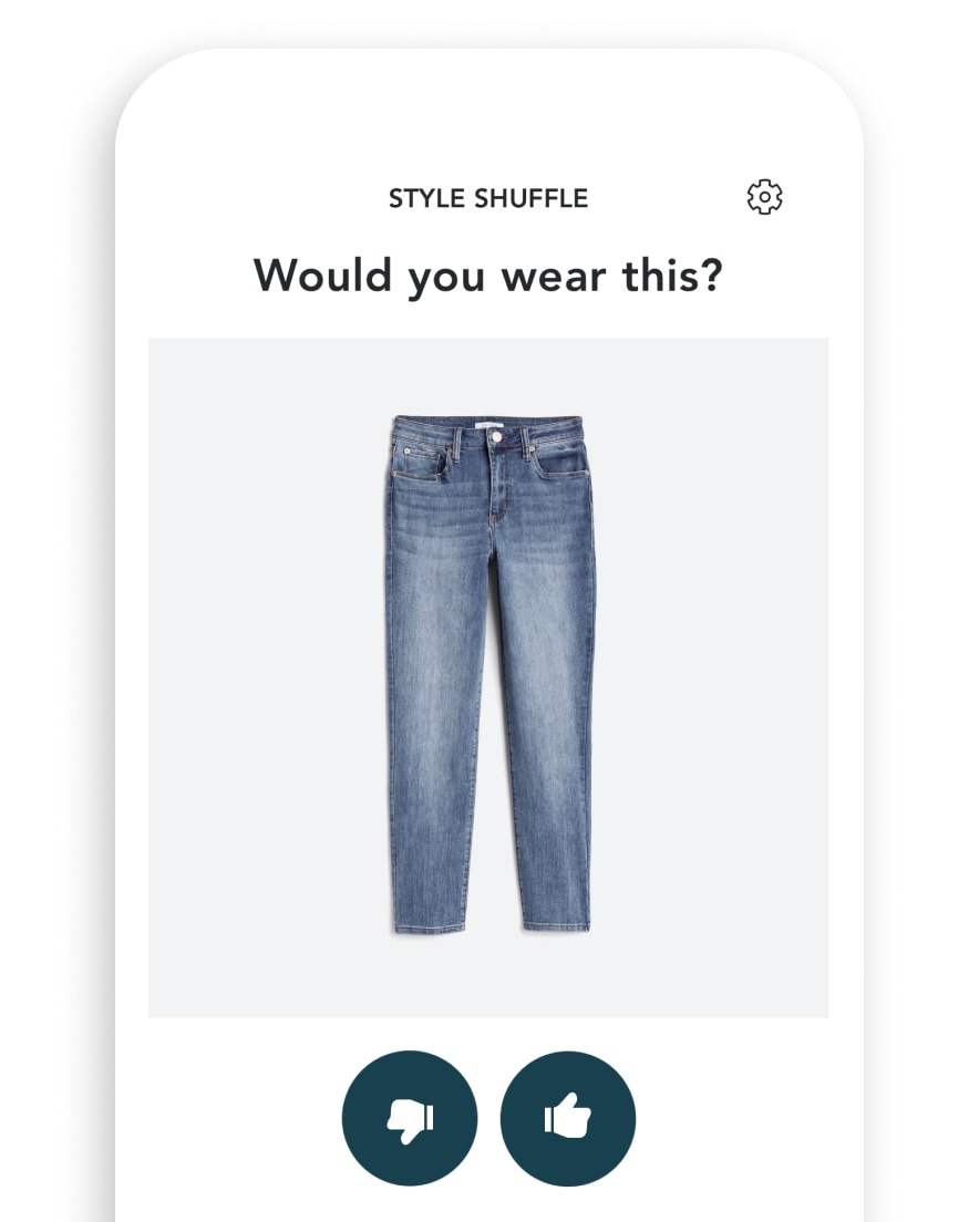 [1.] Phone with image of Stitch Fix Style Shuffle with jeans and thumbs-up or thumbs-down