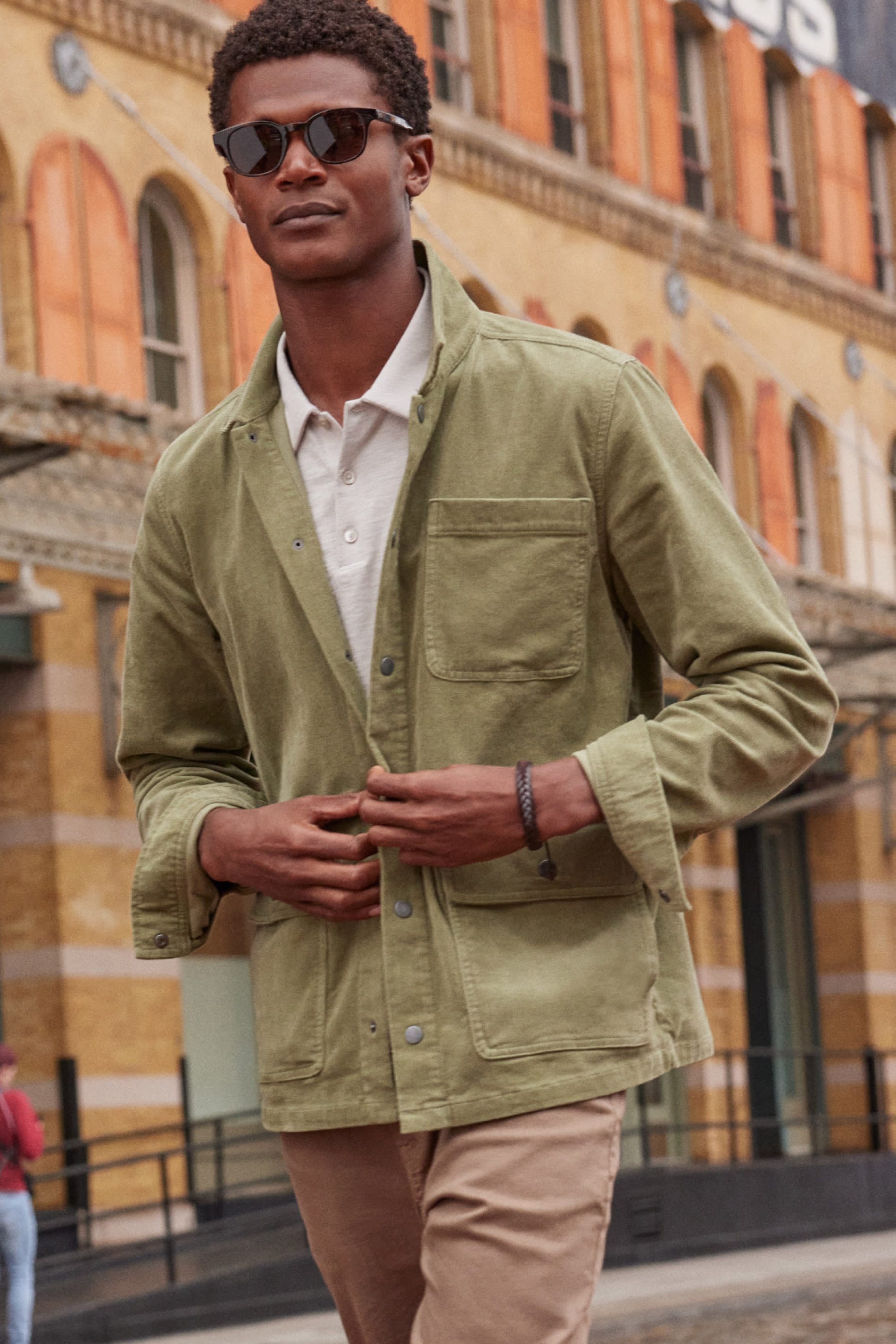 Model wearing Stitch Fix men’s clothing including trending utility jacket and pants.